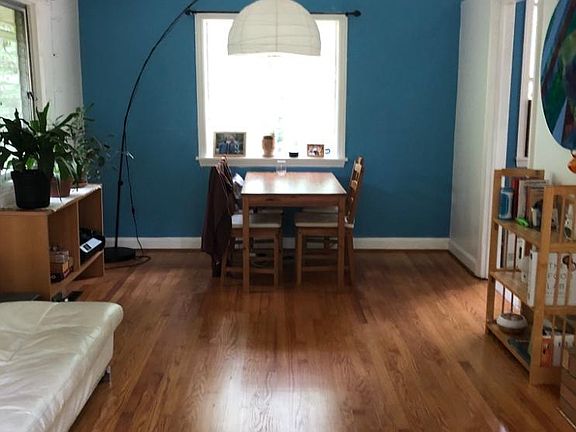 Dining and living room combined with fireplace