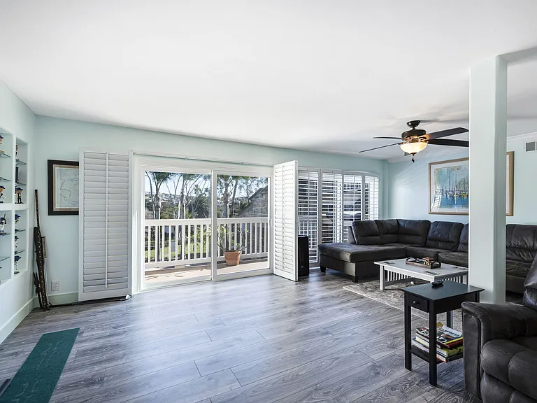 Sliding glass doors allow for the ocean breeze to keep you comfortable . There is central AC for those hot summer nights