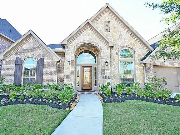 Beautiful Perry Home with professional landscaping adds great curb appeal to your home. Upgraded stone and brick elevation