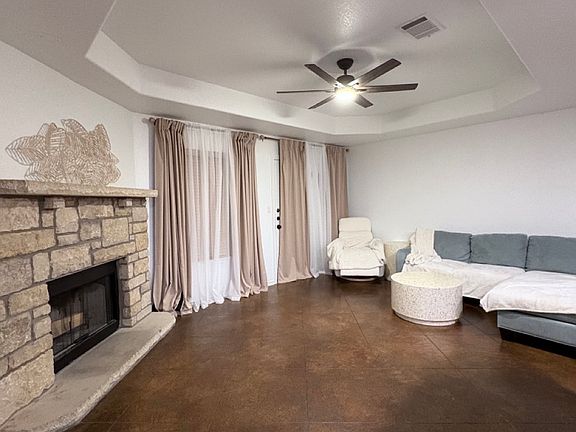 A spacious, cozy living room offers the perfect spot to relax with family or host gatherings with friends.