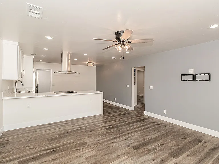 Family Room w/ LVP Flooring and TV Mount.