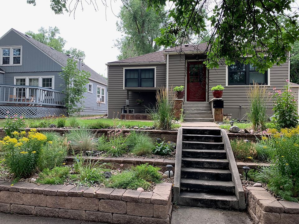 Front of home, covered basement stair entry is under the left window.