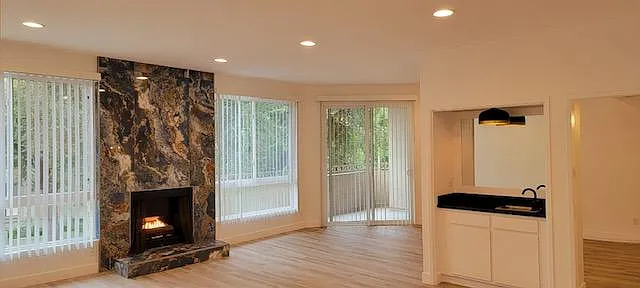 Gorgeous Upgraded Marble Fireplace center to the beautiful, spacious Living Room
