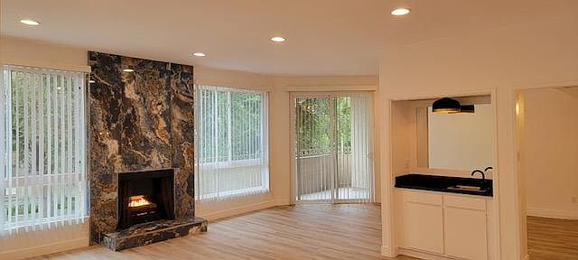 Gorgeous Upgraded Marble Fireplace center to the beautiful, spacious Living Room