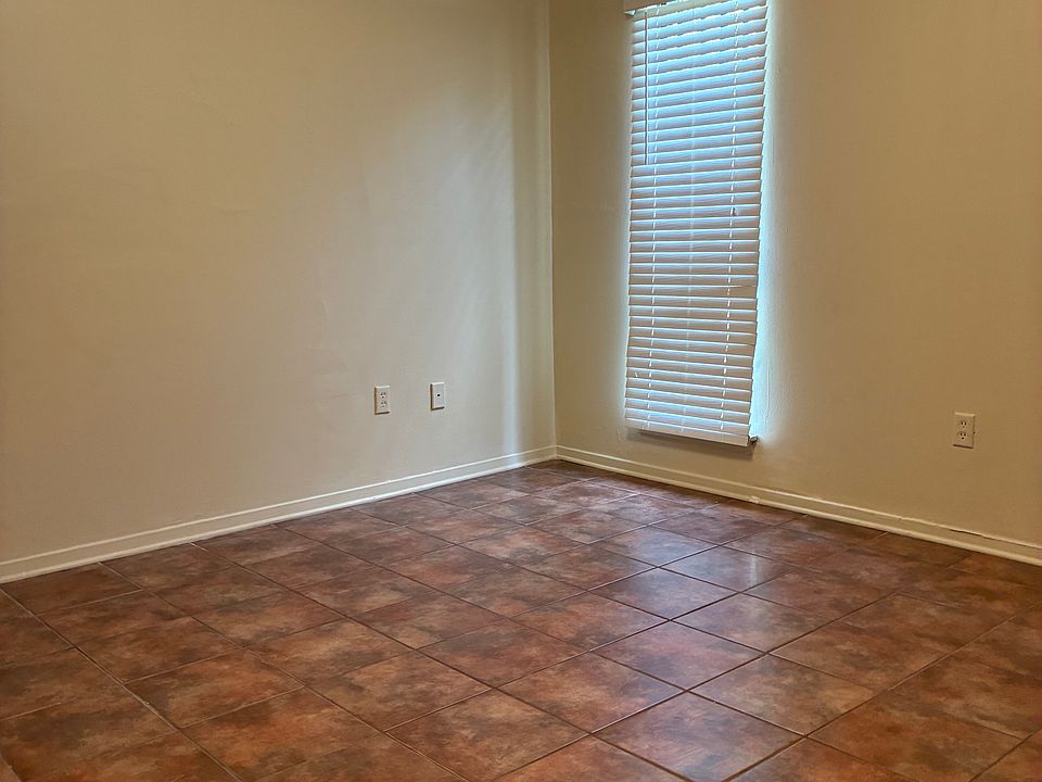 Bedroom. Tile floors.