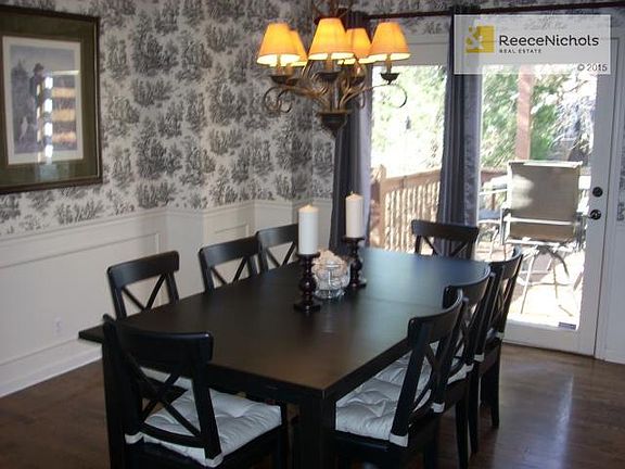 Formal Dining with Hardwood floors and View of Deck