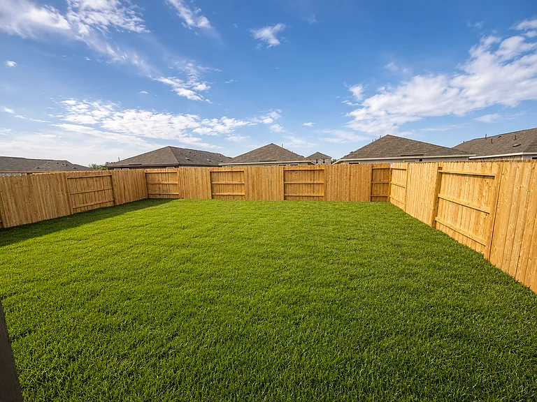 Generously sized backyard perfect for entertaining, gardening, or enjoying the outdoors.