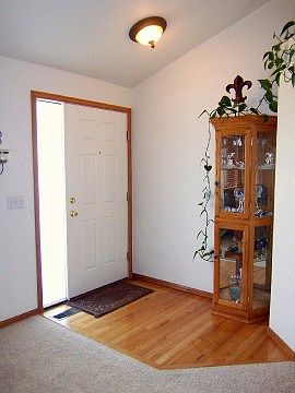 Bright Entry Way with Hardwood Floor