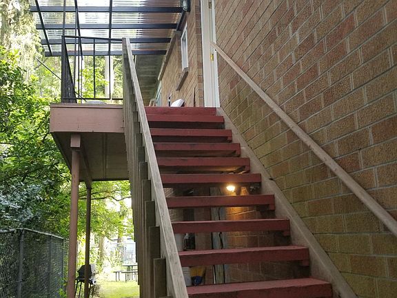 Private entry to Apt #5, with it's own private balcony and new clear patio cover for use rain or shine!