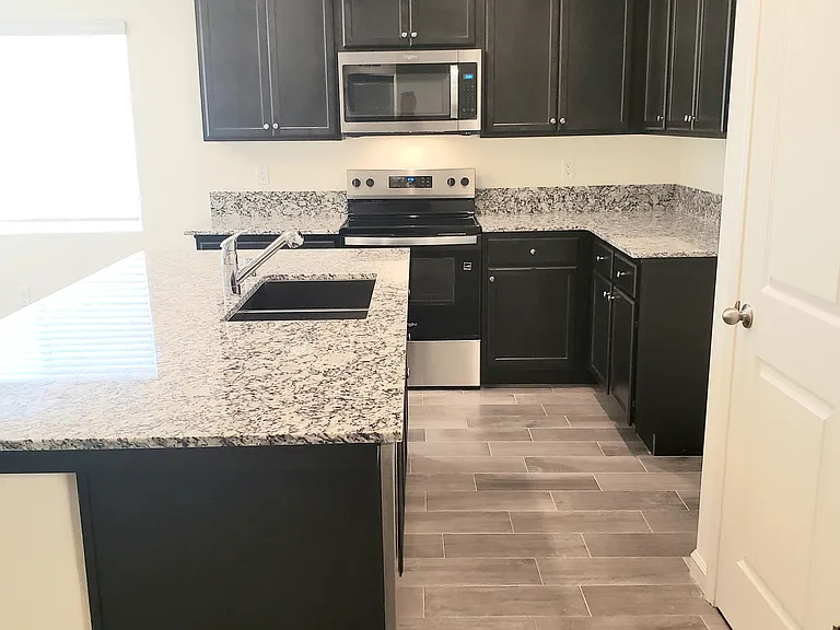 Nice kitchen island and a pantry.