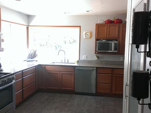 Kitchen overlooks backyard