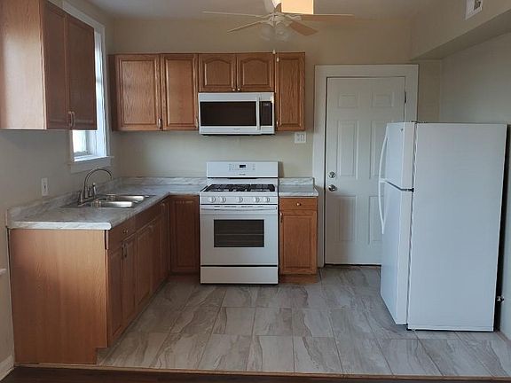 Gorgous kitchen with stone flooring for easy cleaning