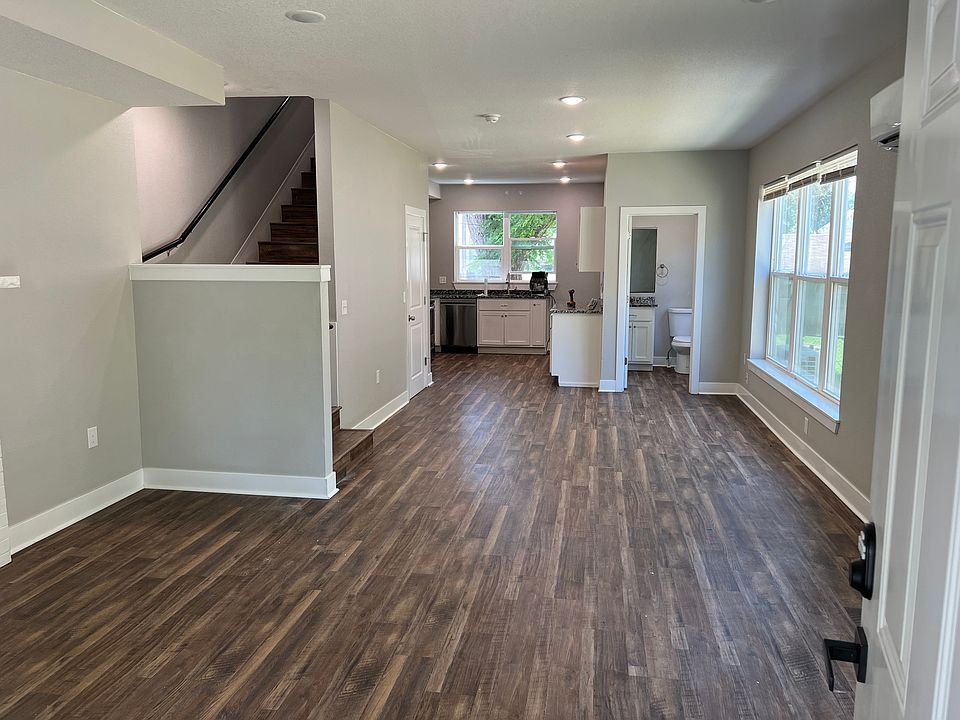 Entry way and Living Room with a view into the kitchen