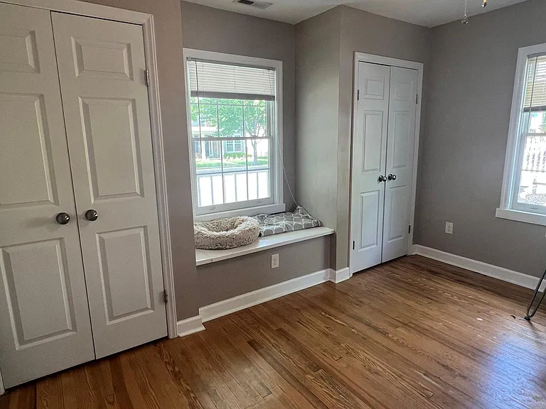 second bedroom with window seat storage