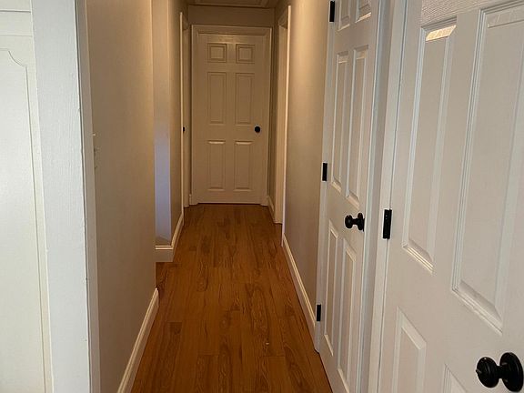 Hallway to bedrooms and bathroom and two closets