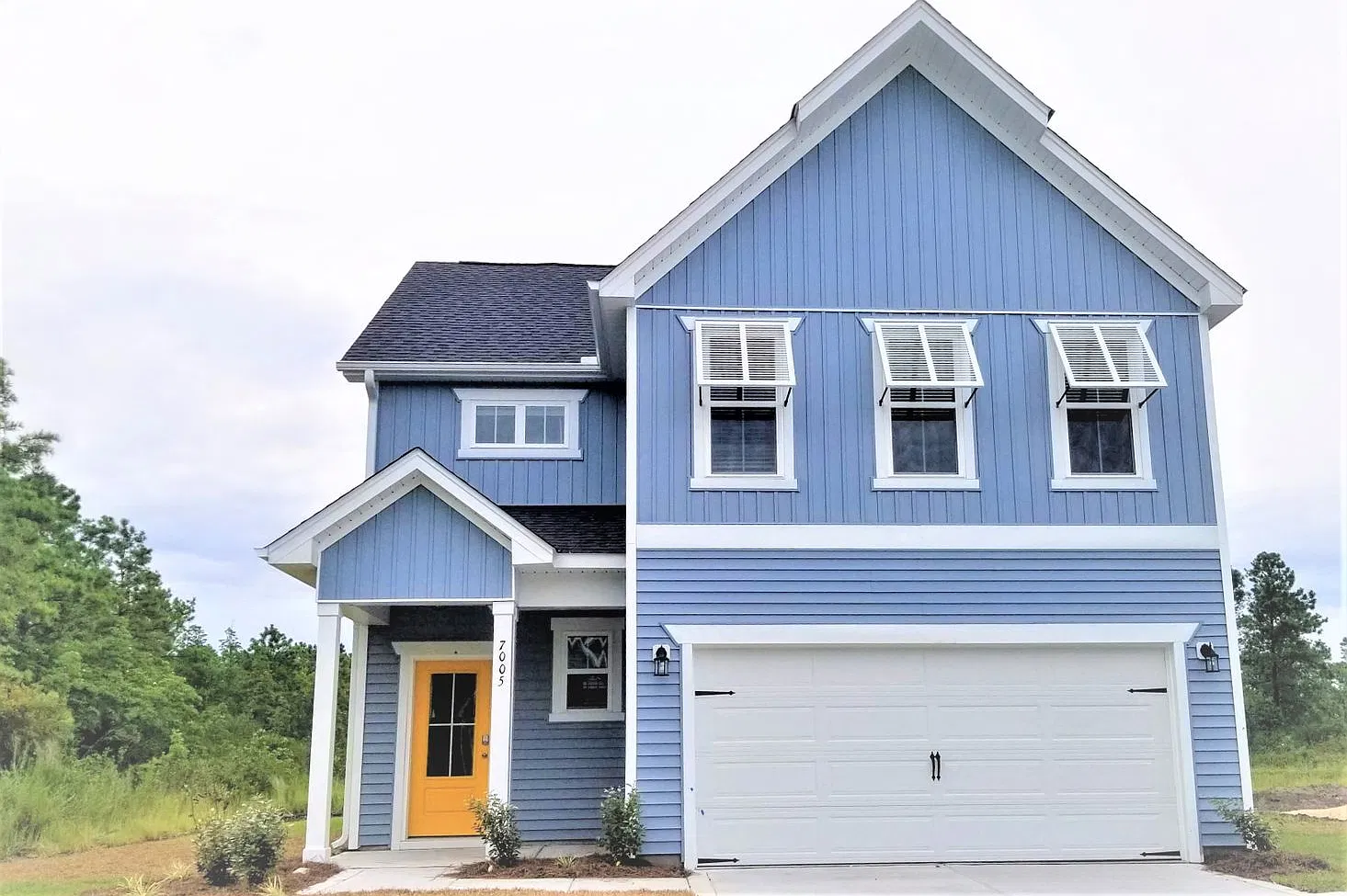 Beautiful home with a charming wrap-around front porch and open floor plan! — Photo 1