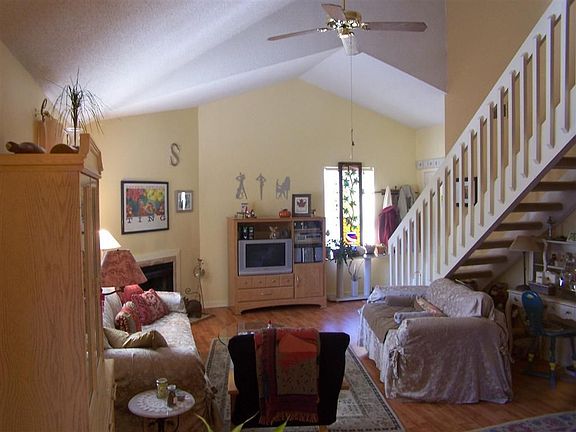 Great room with Cathedral ceilings and woodburning fireplace