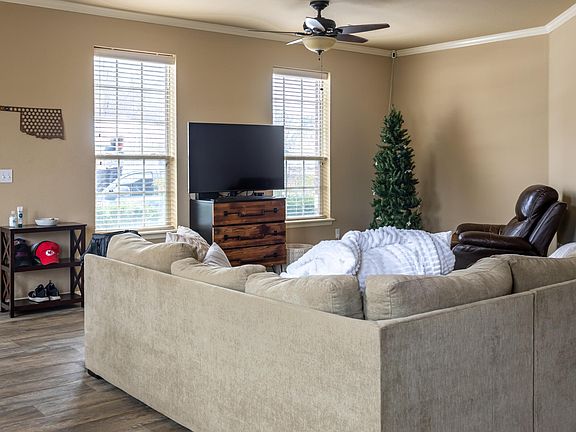 Cozy and spacious living area with ample natural lighting.