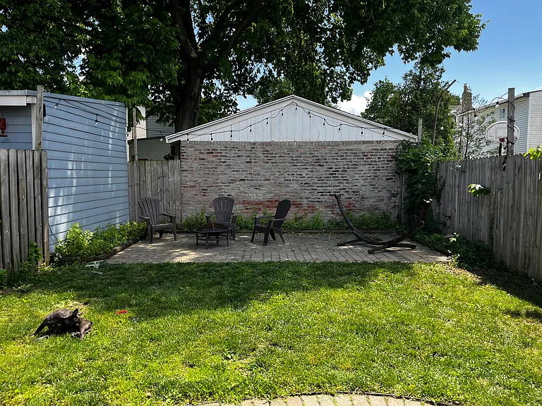 Gated backyard with patio