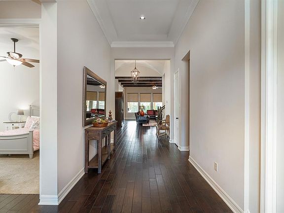 The front entry is graced with beautiful hardwood flooring that flows all the way through to the formal dining room and family room!
