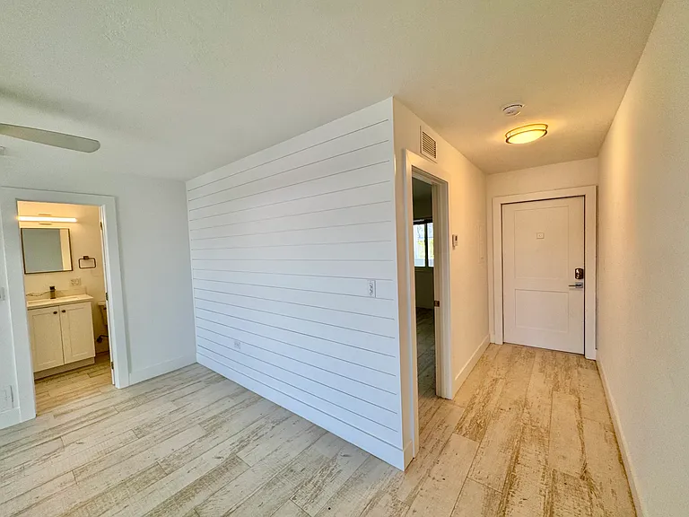 Front Door and entrance to Bedroom and Bathroom