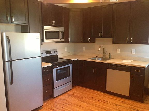 Kitchen with stainless steel appliances and ample storage
