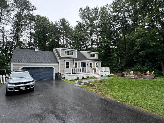 2 car garage, front porch, patio/fire pit area
