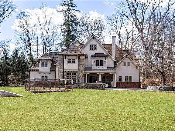 Private and quiet backyard with covered stone terrace and built-in outdoor grill