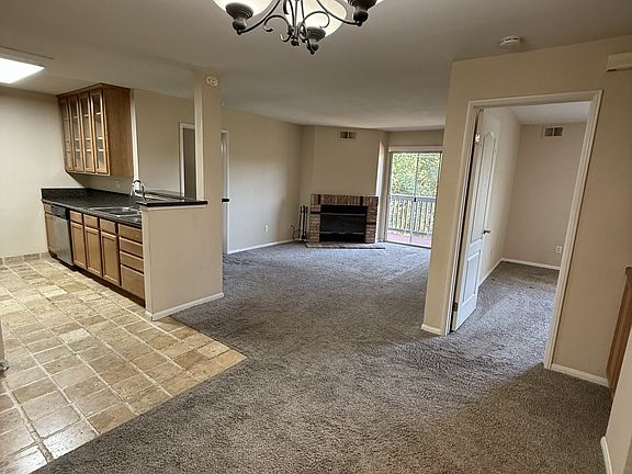 View from Dining room. Kitchen on left. Bedroom straight ahead on right