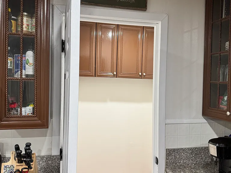Walk in pantry/bonus room located in kitchen. Shelving will be hung prior to move in time.