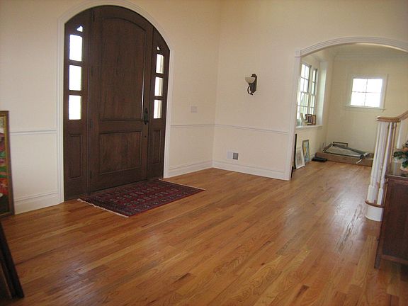 Foyer - hardwood floor, decorative wall molding