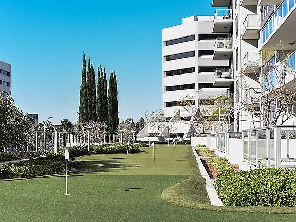 Putting green next to community building.