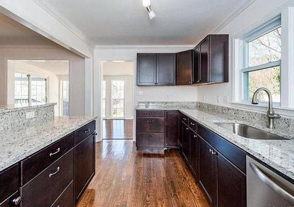 Kitchen looking toward sunroom (unfurnished)