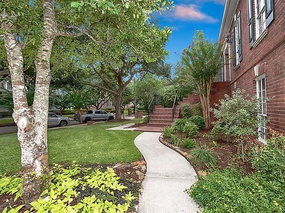 A view of the lush landscaping and walkway to the front porch. Truly stunning.