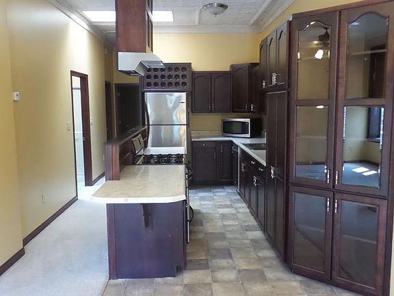Kitchen with stainless appliances with skylights