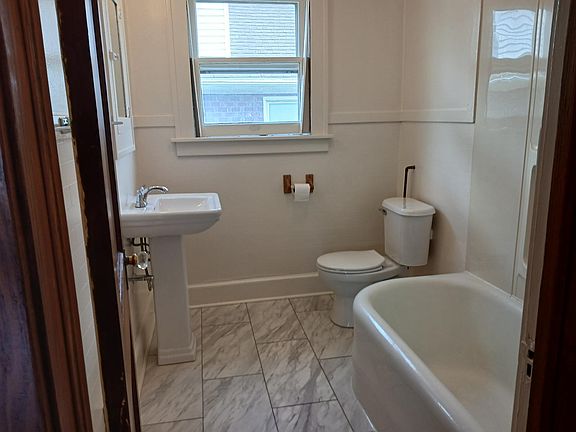 Newly remodeled bathroom: New Sink, toilet and floor.