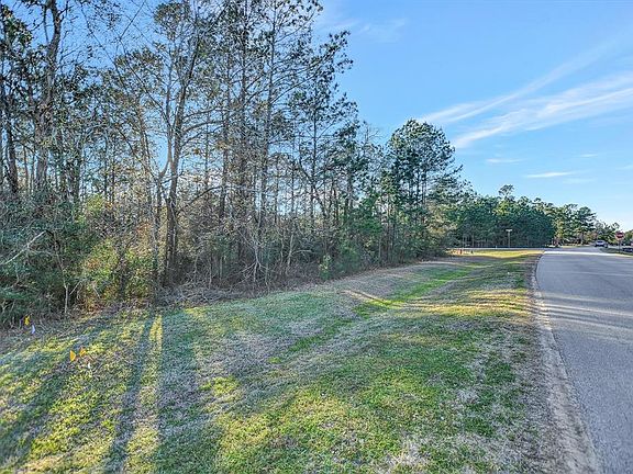 Heavily wooded with mature oaks