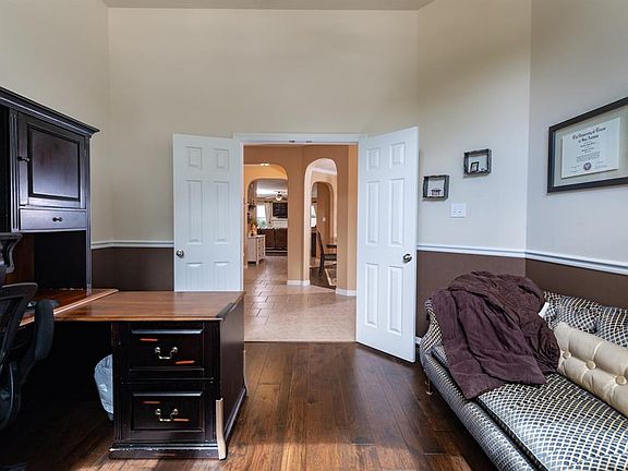 Double doors open from the entry hallway into the study.