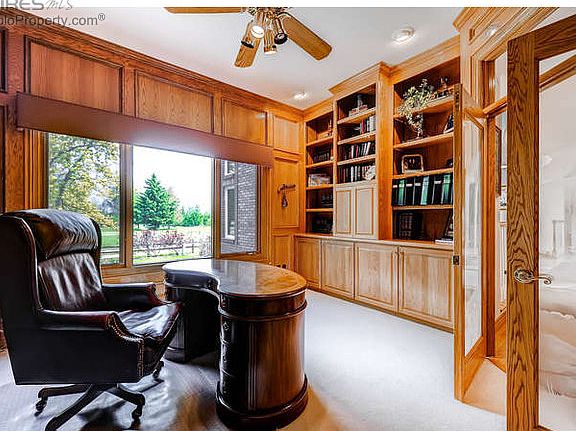 Office with built-ins and golf course views