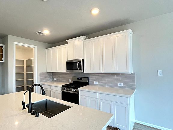 Construction progress - kitchen with center island and walk-in pantry