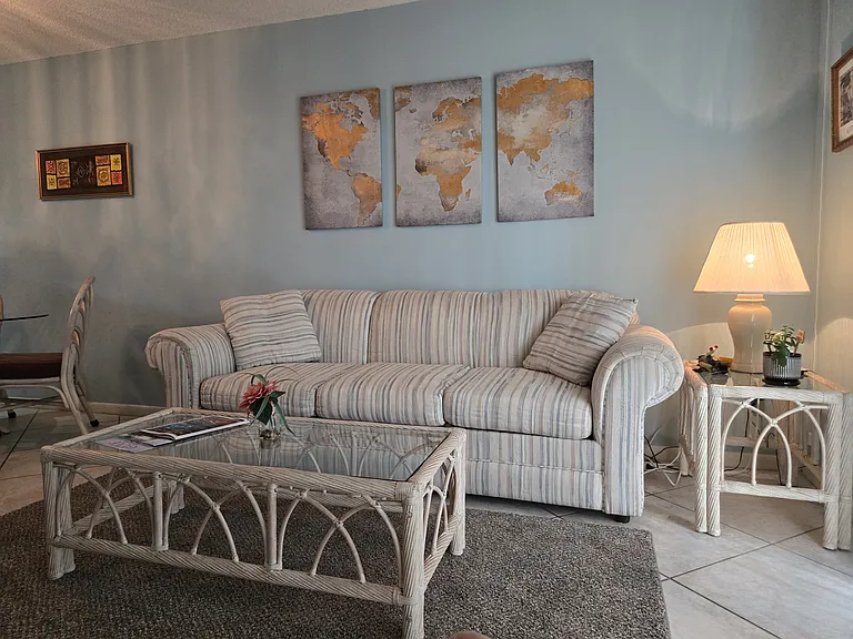 LIVING ROOM BESIDE THE LANAI OFFERS TONS OF NATURAL SUNLIGHT