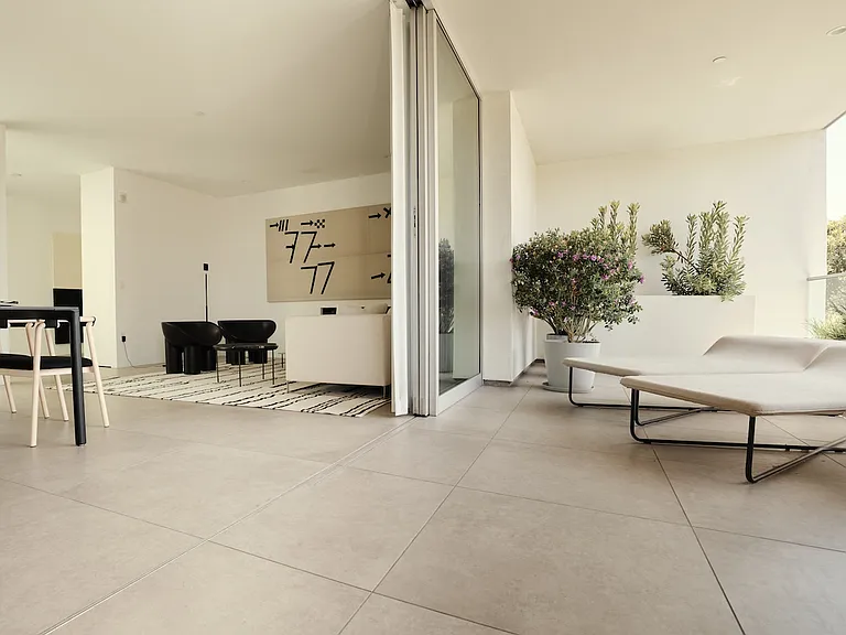 Expansive Living and Dining Space with Open-Air Flow _ Thoughtfully designed for entertaining, this space transitions effortlessly to a private outdoor terrace, allowing for a true indoor-outdoor lifestyle.
