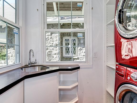 Laundry room with sink and storage