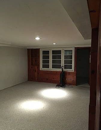 Large room in basement for storage or office