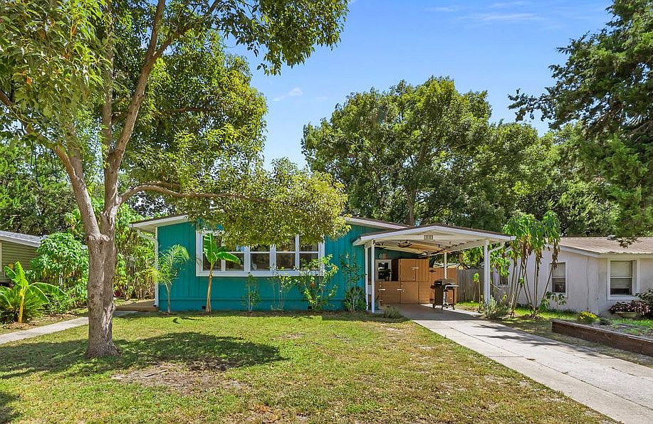 Welcome home to 113 Phoenetia Dr! The front of the home showcases a tropical vibe with multiple fruit trees, including banana, fig, guava, mulberry, and cherry.