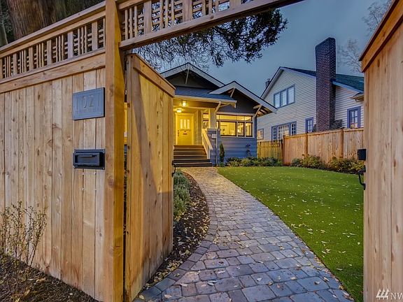 Beautiful gated entrance to professionally landscaped landscaping and hardscaping.