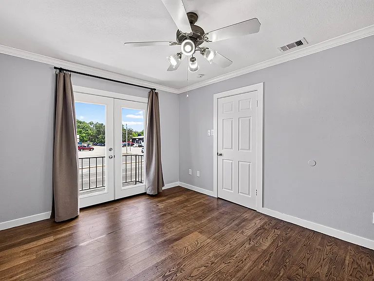 One of the bedroom with private balcony looking out to the main street.