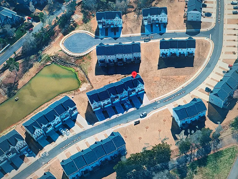 The red dot is your new future home. It has a beautiful view of the pond and your mail box is few steps from the townhome.