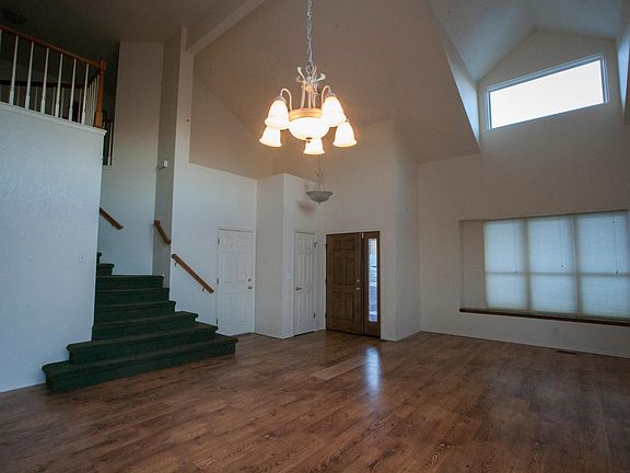 front room and stairs leading to Master bedroom, bedroom #2 and #3, and laundry room