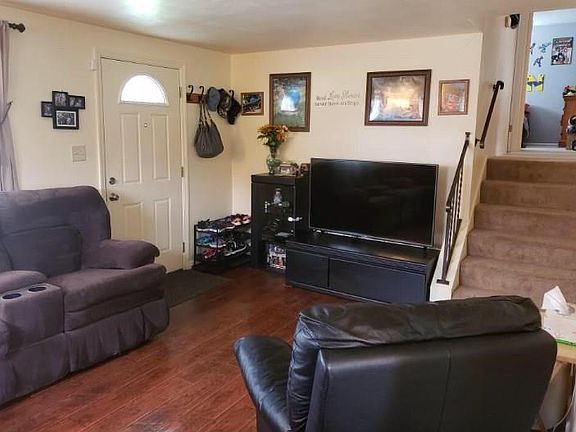 Make your way up a few steps from the living room to the 3 bedrooms and full bath.